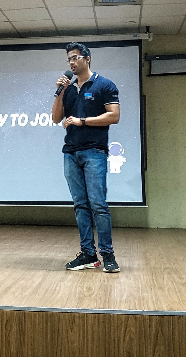 Vedant Somani presenting on stage